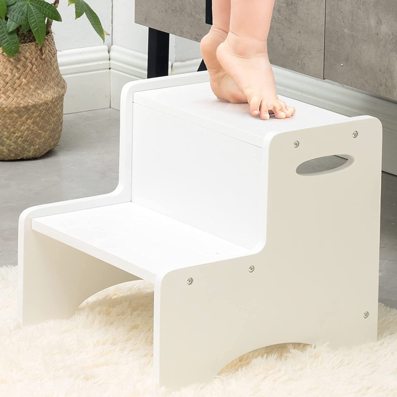 Toddler step stool in bathroom next to sink
